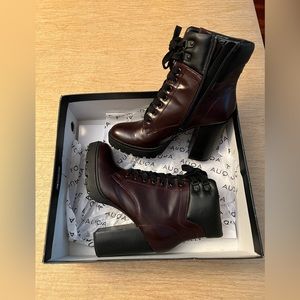 Tie up burgundy and black heel booties.